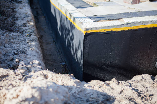 Professional Waterproofing technician working in Beachwood, OH